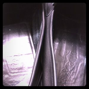 Black Ferragamo loafers.